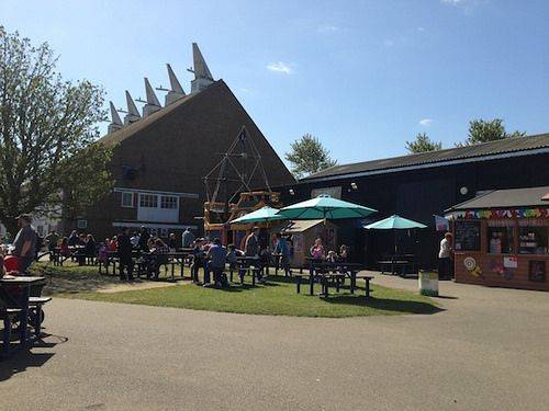 Outdoor seating area next to Oast House