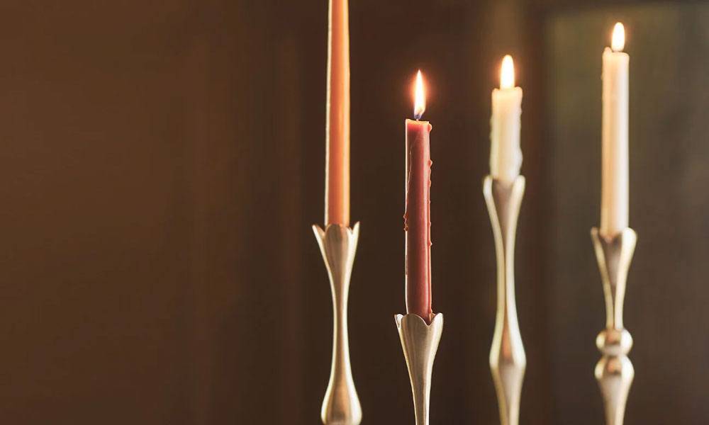 Candle display of four candles Anthropologie - a candle display of four candles