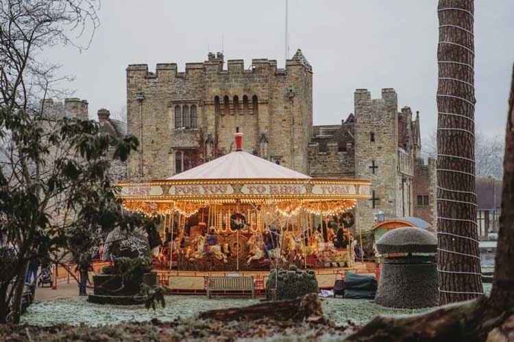 Hever Castle Christmas Carousel A carousel in front of Hever Castle at Christmas