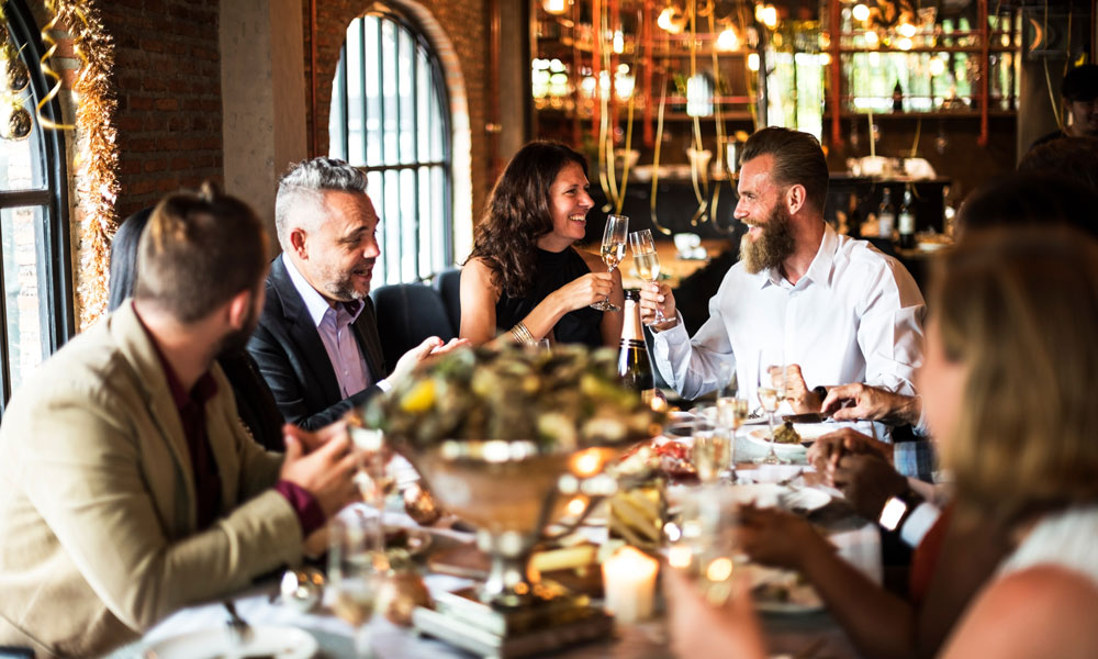 A group enjoying a meal in a restaurant A group enjoying a meal in a restaurant