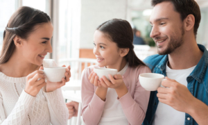 A family enjoying cups of tea