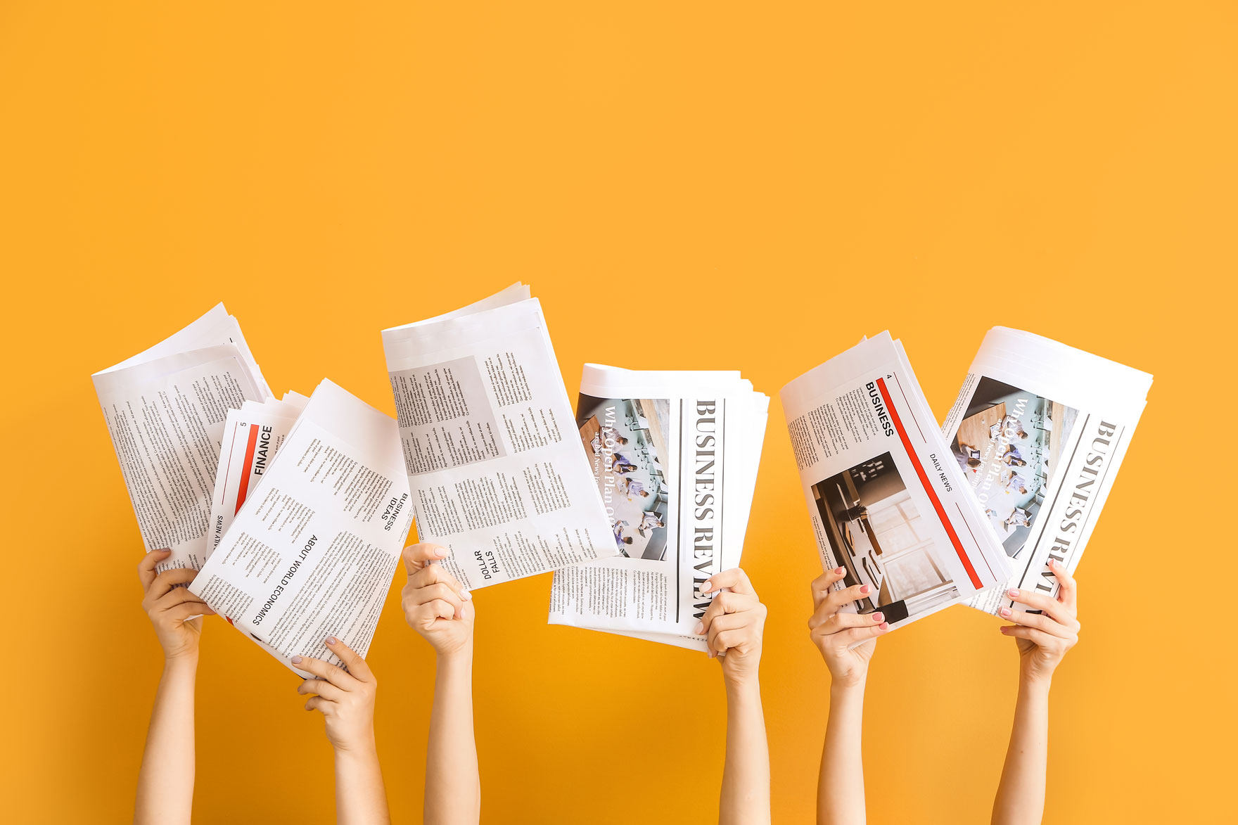 Newspapers being held up by 6 hands