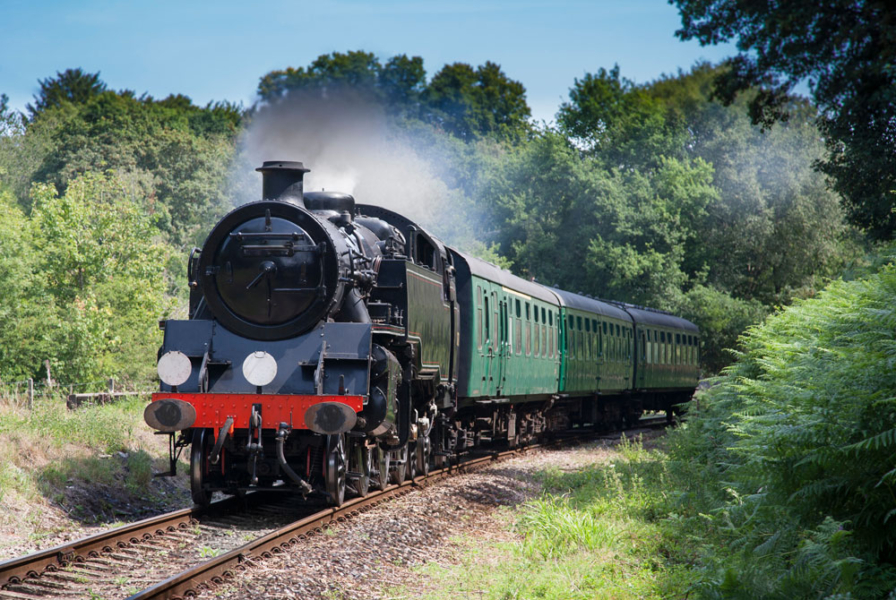 Spa-Valley-view-web-res Black steam train running along the tracks