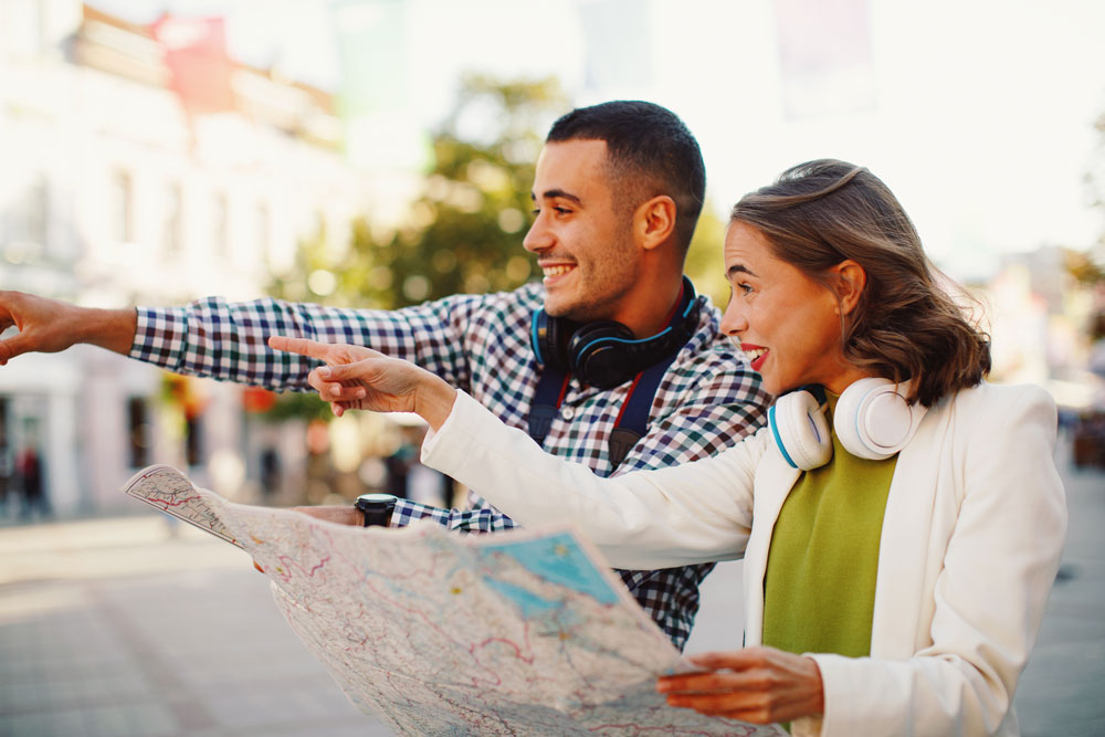 Tourist looking at a map and pointing