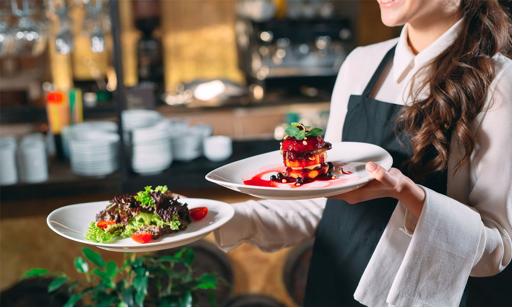 Waitress serving a meal