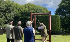 A group of men practicing shooting targets