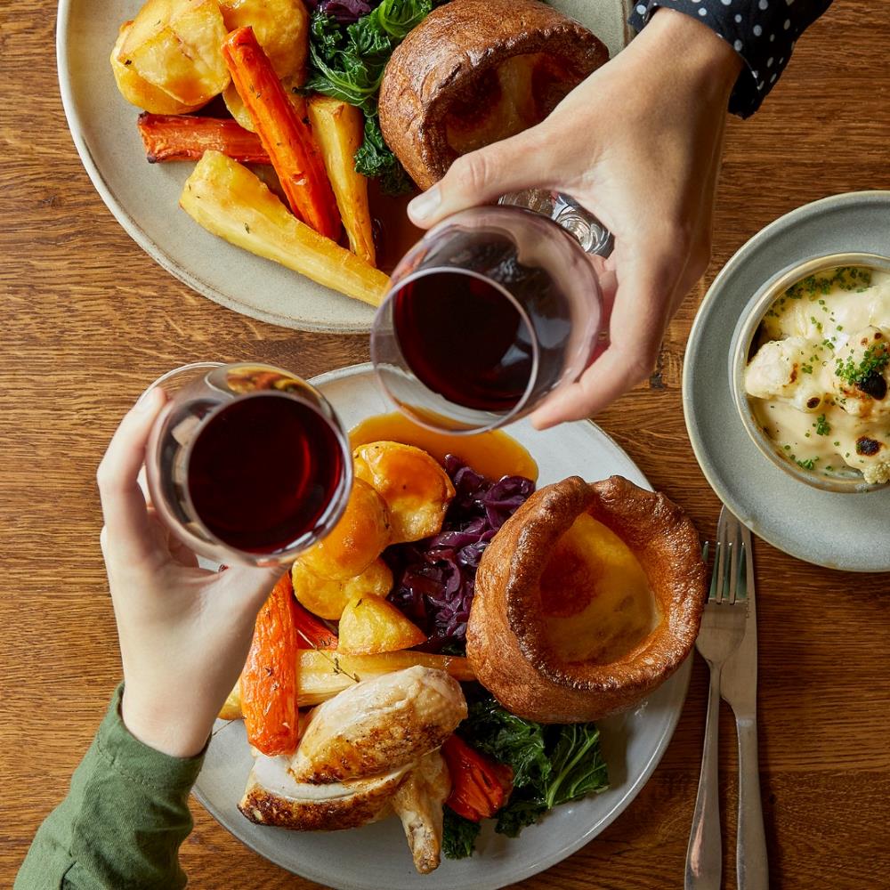 The Guinea Sunday roast Two people having a roast dinner