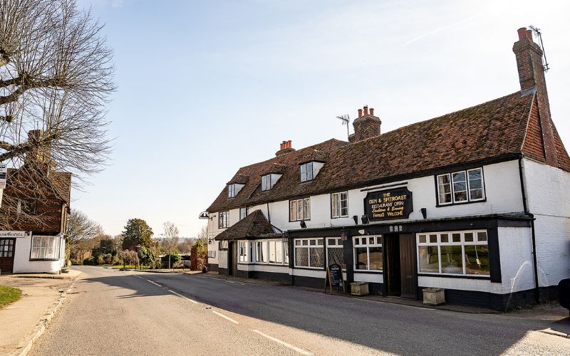 Old fashioned pub next to a road