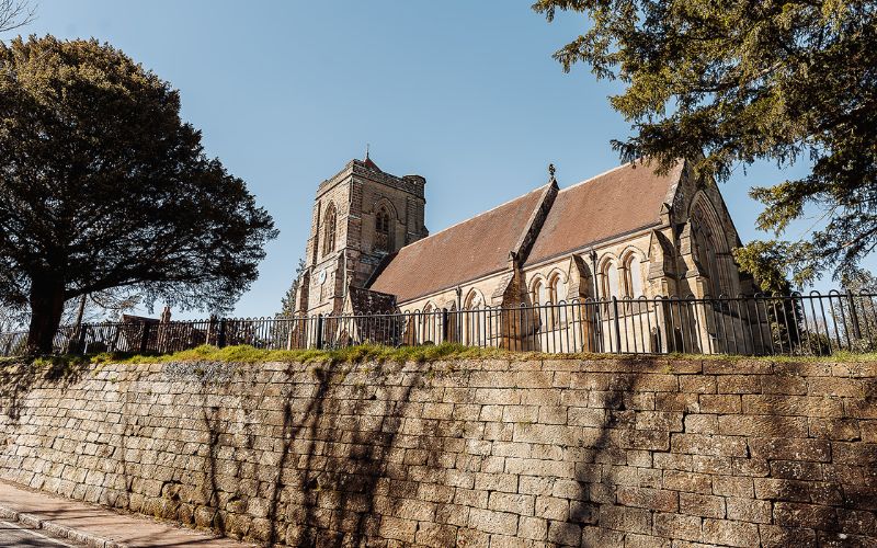 Village church with wall in foreground