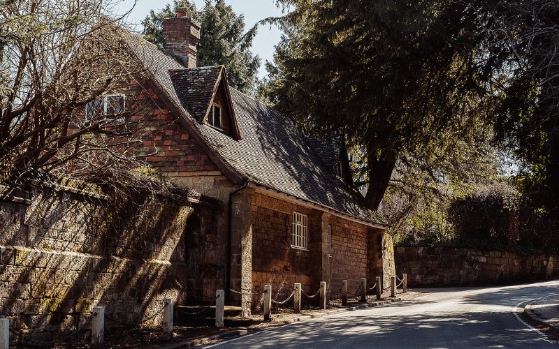 Old house on the left hand side of a small road