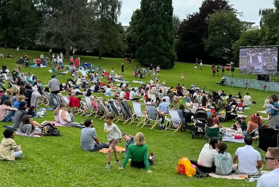 Crowd at an outdoor cinema sports screening