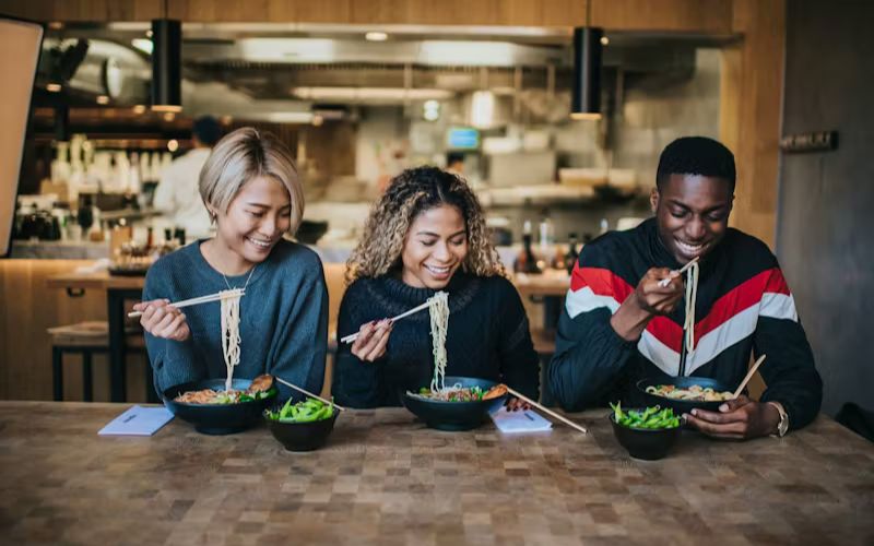 Wagamama 800×500 People eating an Asian inspired meal